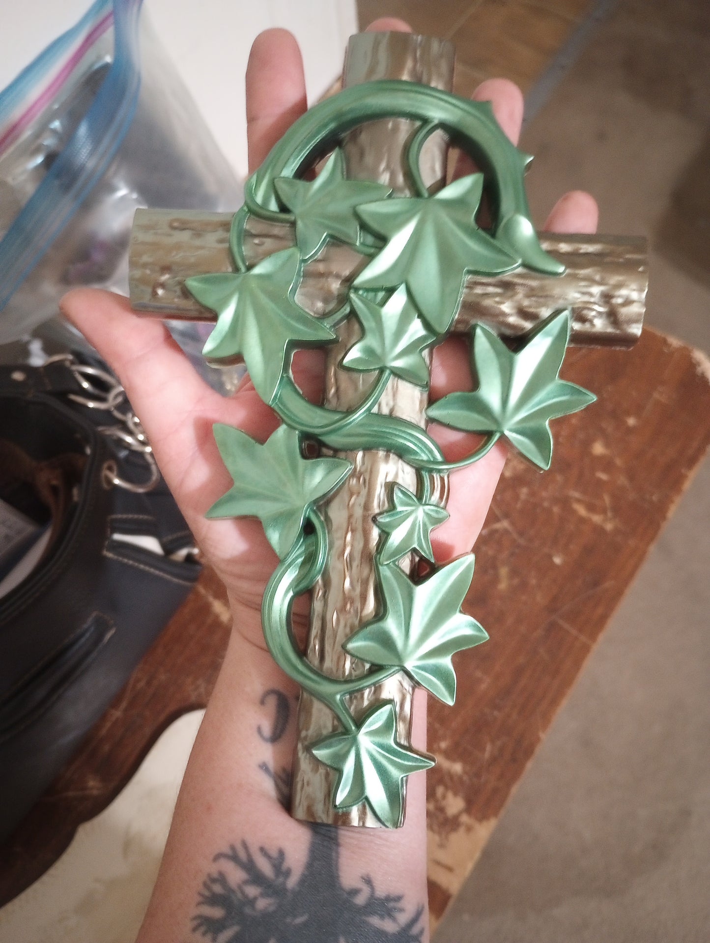 Cross covered with greenery